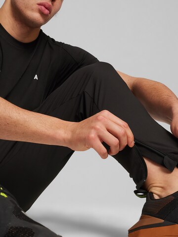 juoda PUMA Standartinis Sportinės kelnės 'Ultraweave'