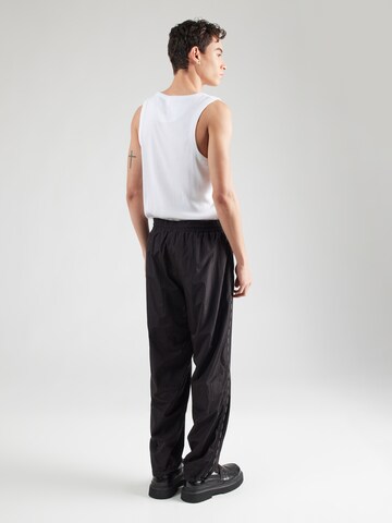 Tapered Pantaloni di Versace Jeans Couture in nero