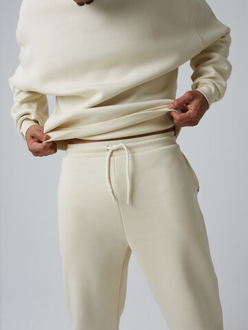 ABOUT YOU x Benny Cristo Regular Pants 'Keno' in Beige