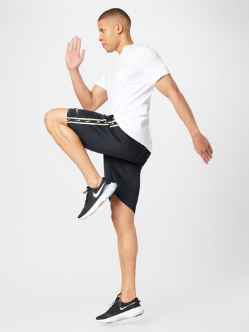Nike Sportswear Loose fit Pants 'REPEAT' in Black