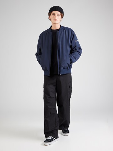 Veste mi-saison Champion Authentic Athletic Apparel en bleu