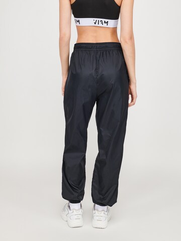 ABOUT YOU x VIAM Studio Loose fit Trousers in Black: back