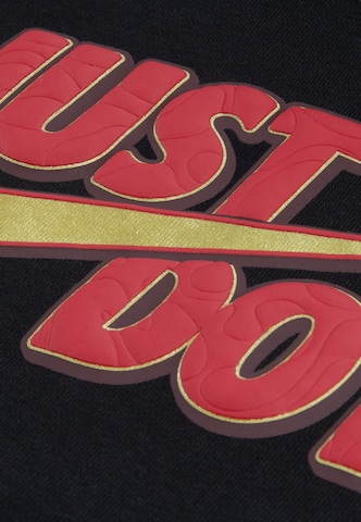 Tuta da jogging 'FROST FUTURA' di Nike Sportswear in nero: frontale