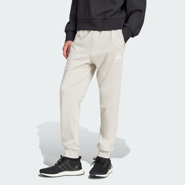 ADIDAS SPORTSWEAR Tapered Sports trousers 'Essentials Feel Cozy' in Grey: front