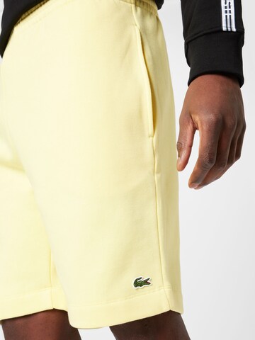 LACOSTE Regular Trousers in Yellow