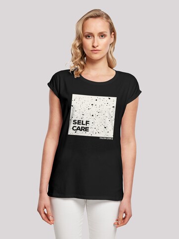 T-shirt 'Self Care' F4NT4STIC en noir : devant