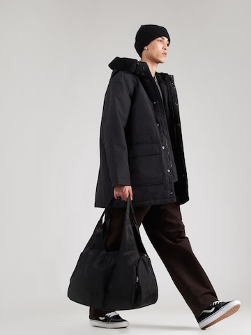 Carhartt WIP Téli parka 'Siberia' - fekete