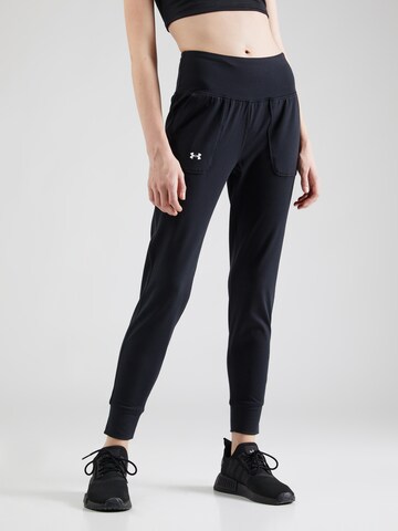 UNDER ARMOUR Tapered Sports trousers 'Motion' in Black: front