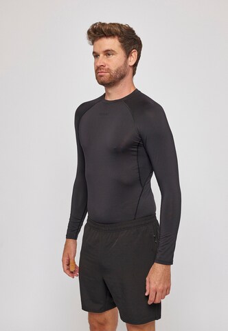 Maglia funzionale di SNOCKS in nero