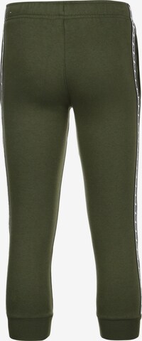 Effilé Pantalon 'Repeat' Nike Sportswear en vert