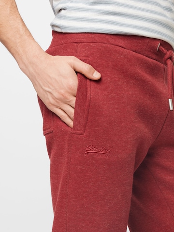 Superdry Zúžený Kalhoty – červená