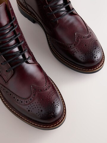 Boots stringati di Next in rosso