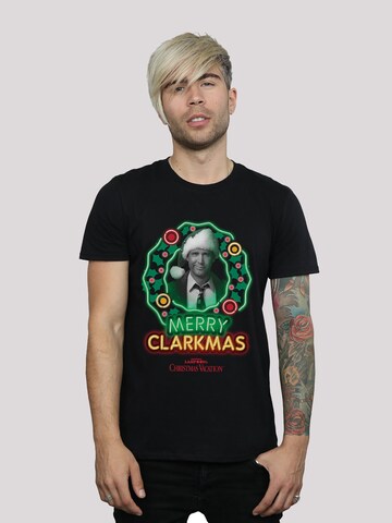 F4NT4STIC Shirt 'Lampoons Christmas Vacation Merry Clarkmas' in Zwart: voorkant