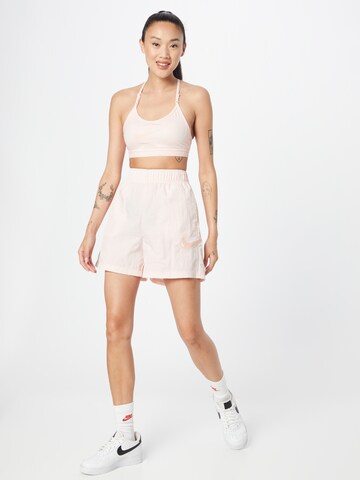 Nike Sportswear Loosefit Housut värissä vaaleanpunainen