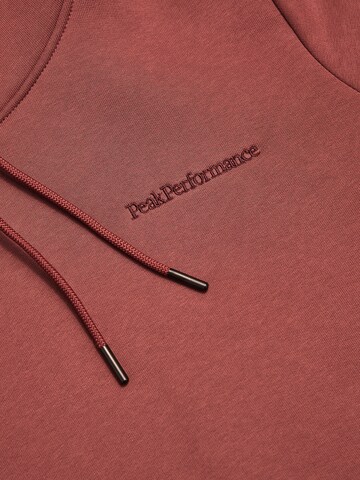 PEAK PERFORMANCE Sweatshirt in Rood