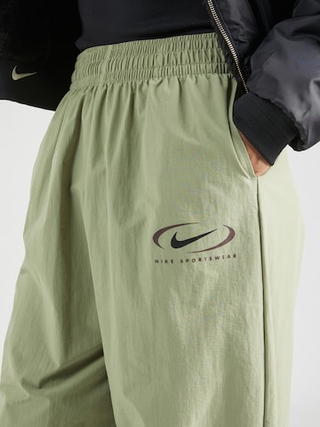žalia Nike Sportswear Siaurėjantis Kelnės