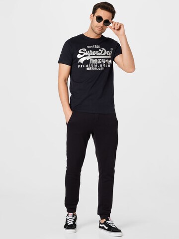 Superdry Дънки Tapered Leg Тениска в черно