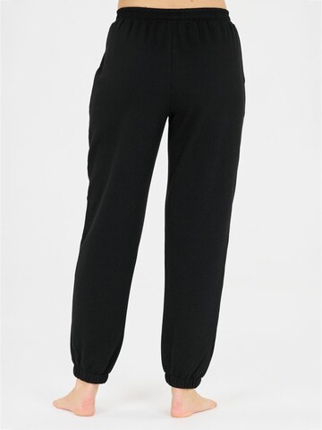 Athlecia - Tapered Pantalón deportivo 'Atkins' en negro