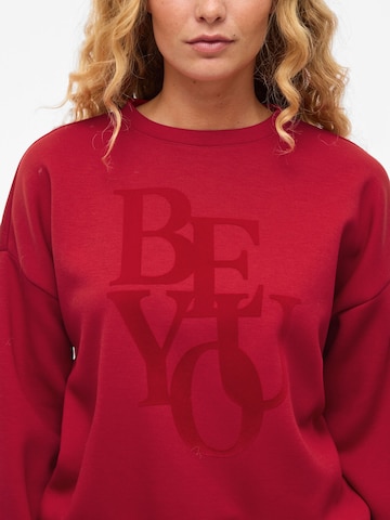 Sweat-shirt 'VIReflect' VILA en rouge