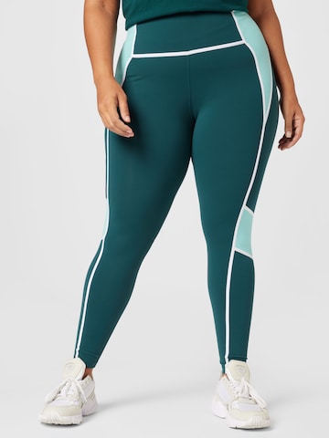 Skinny Pantalon de sport 'Lux' Reebok en vert : devant