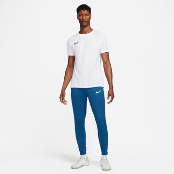 NIKE Slim fit Sports trousers in Blue