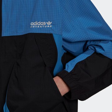 mėlyna ADIDAS ORIGINALS Demisezoninė striukė