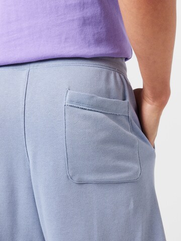 Loosefit Pantalon 'CLUB ALUMNI' Nike Sportswear en bleu