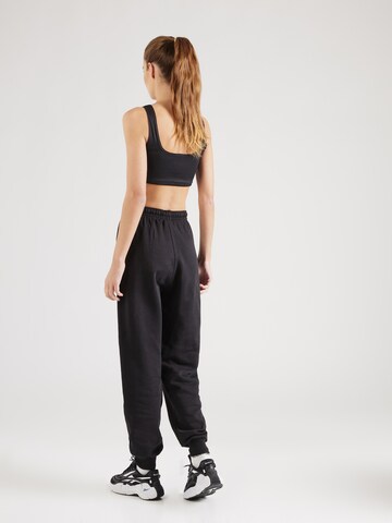 Effilé Pantalon de sport Reebok en noir