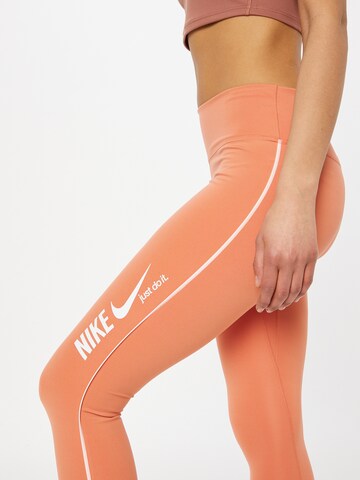 NIKE Skinny Sports trousers in Orange