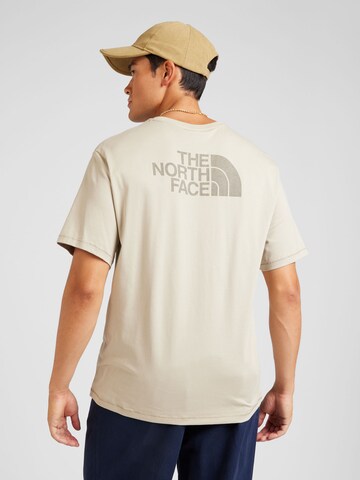 THE NORTH FACE Koszulka w kolorze beżowy: przód