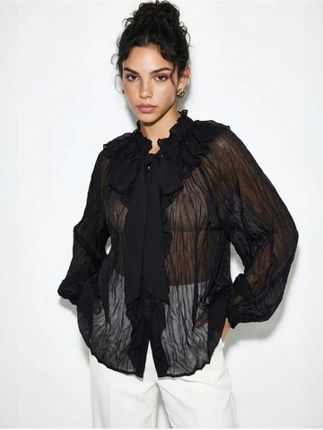 Bianco Lucci - Blusa em preto: frente
