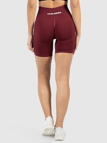 Coupe slim Pantalon de sport ' Nomeli ' Smilodox en rouge
