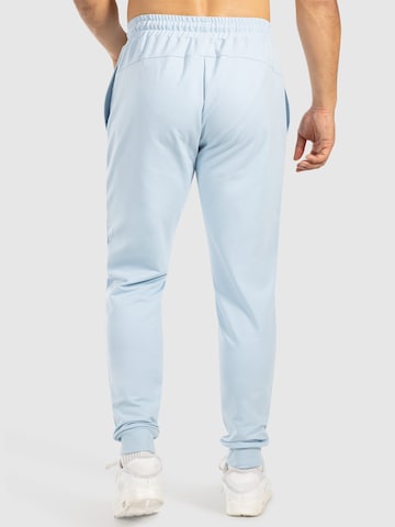 Effilé Pantalon de sport 'Nilo' Smilodox en bleu