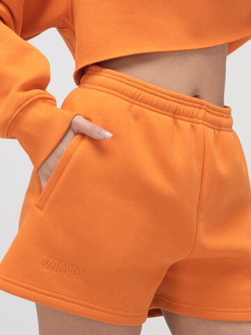 ABOUT YOU x VIAM Studio Regular Shorts 'BILLIE' in Orange