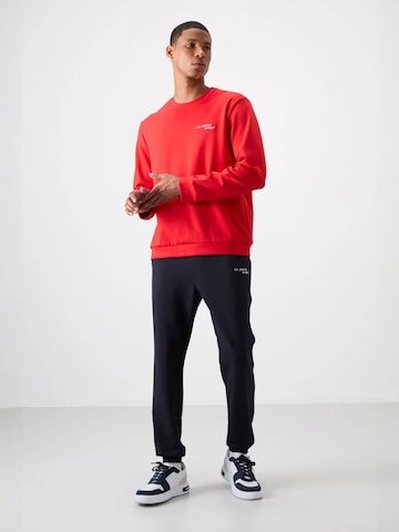 Tommy Life Joggingpak in Rood: voorkant