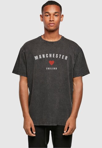 Merchcode T-Shirt 'Manchester X' in Schwarz: Vorderseite