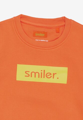 Sweat smiler. en orange