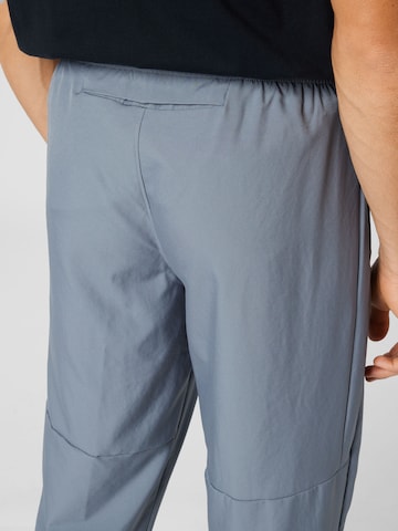 Effilé Pantalon de sport 'Challenger' NIKE en gris