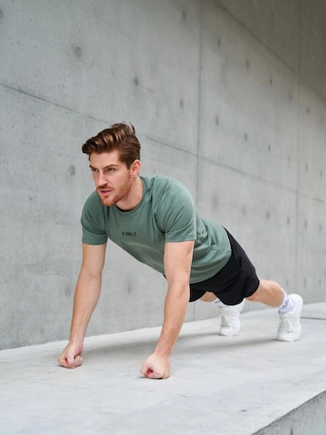 Maglia funzionale 'XFUNCTION Raglan Tee' di DRILLS Apparel in verde