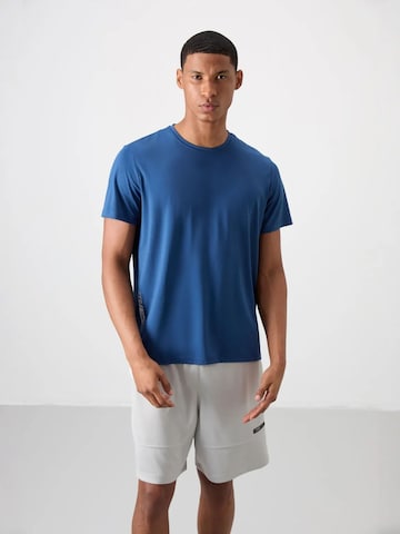 T-Shirt fonctionnel Tommy Life en bleu : devant
