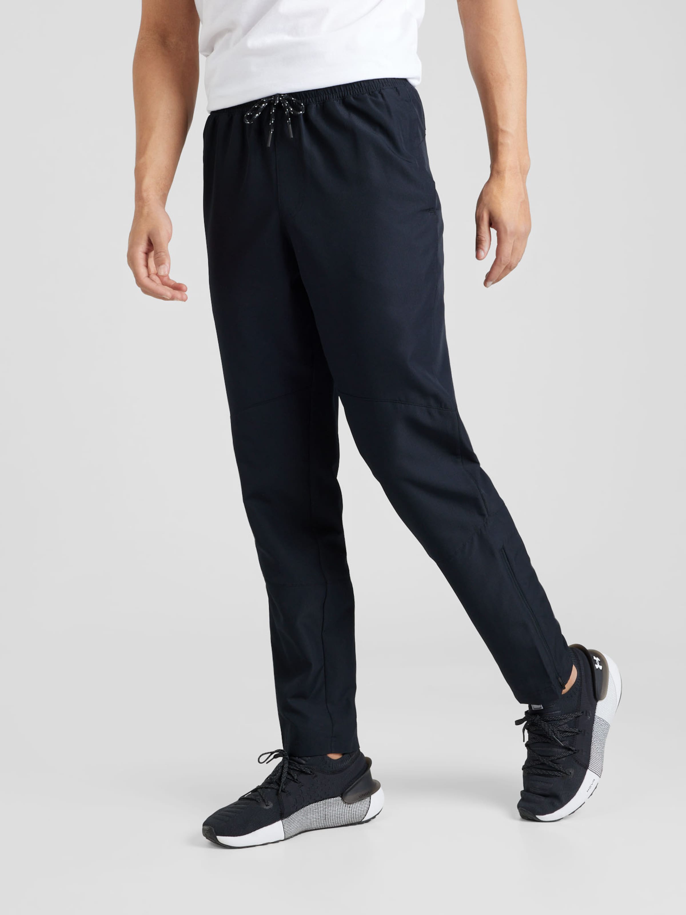 UNDER ARMOUR Slim fit Sports trousers Legacy Windbreaker in Black ABOUT YOU