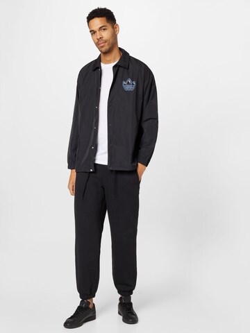 ADIDAS ORIGINALS Between-season jacket 'Graphics Campus' in Black