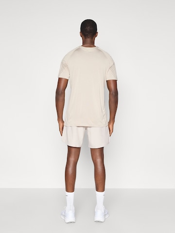 NIKE regular Παντελόνι φόρμας 'CHALLENGER' σε ροζ