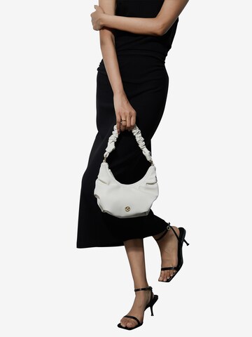 Victoria Hyde Handbag in White: front