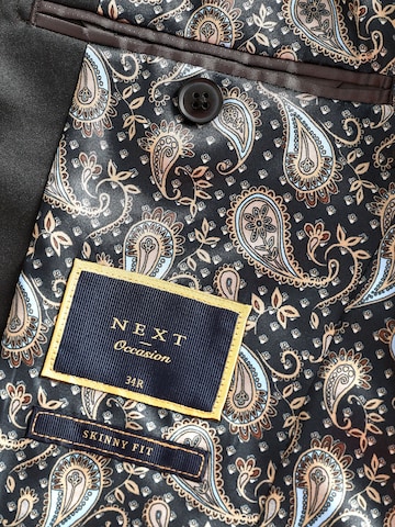Next Slim Fit Pikkutakki värissä musta