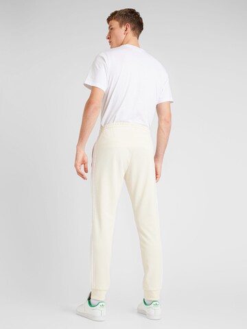 Tapered Pantaloni 'Adicolor Classics SST' di ADIDAS ORIGINALS in bianco