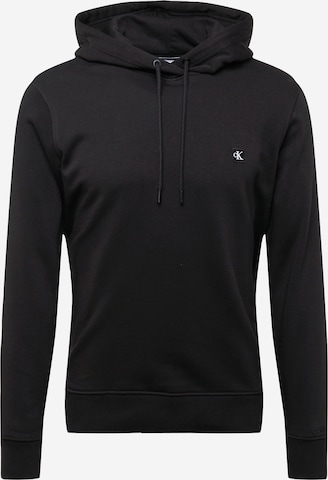 Sweat-shirt Calvin Klein Jeans en noir : devant