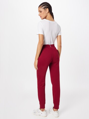 Tapered Pantaloni di TOMMY HILFIGER in rosso