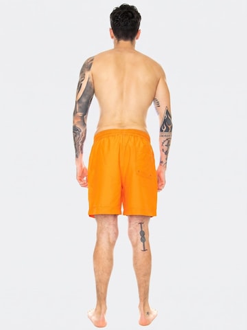 Boardshorts 'Chase Trunk Clockwork / Gold' Carhartt WIP en orange