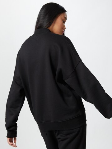 ABOUT YOU x Mero Sweatshirt 'OV Crewneck K' in Black